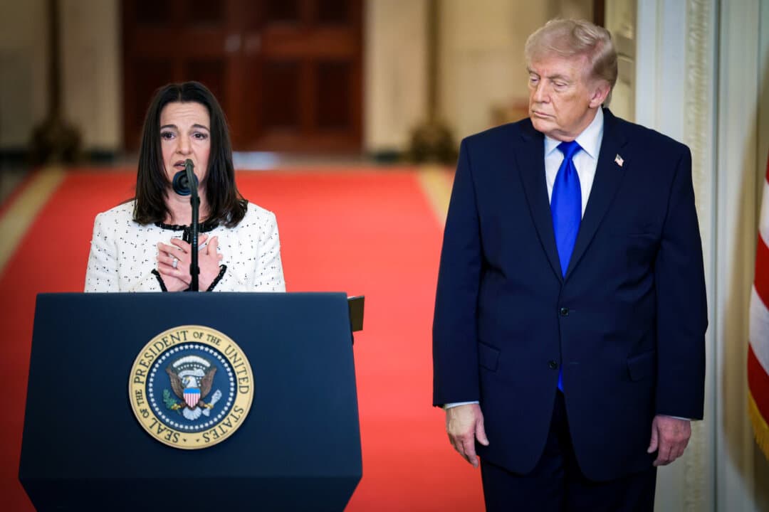 Allyson Phillips, mother of Laken Riley, joins President Donald Trump during a remembrance ceremony at the White House on Feb. 23, 2026. Riley, a 22-year-old nursing student was murdered by an illegal immigrant while jogging. Her death sparked a national conversation about border security and immigration policy. (Win McNamee/Getty Images)