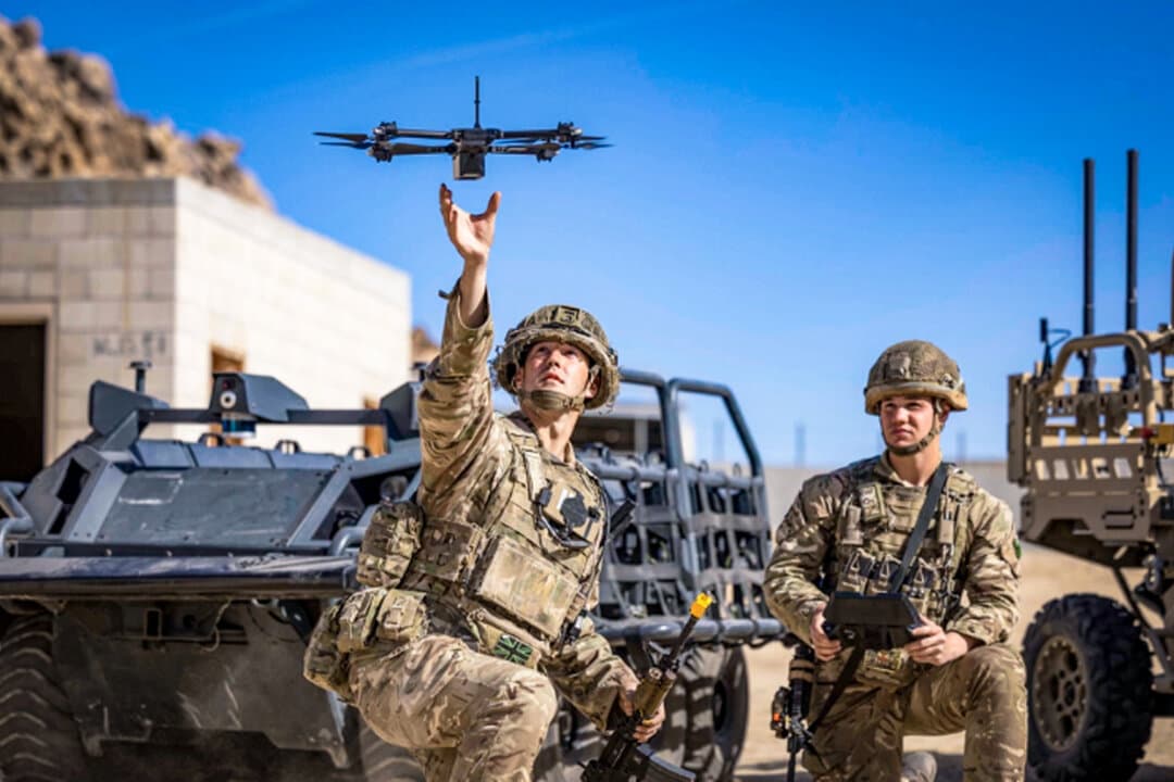 British soldiers launch a drone during Project Convergence exercises at Fort Irwin, Calif., on Nov. 4, 2022. The ongoing, multi-year experimentation program is led by the U.S. Army to test future warfighting concepts. (DVIDS via AP)