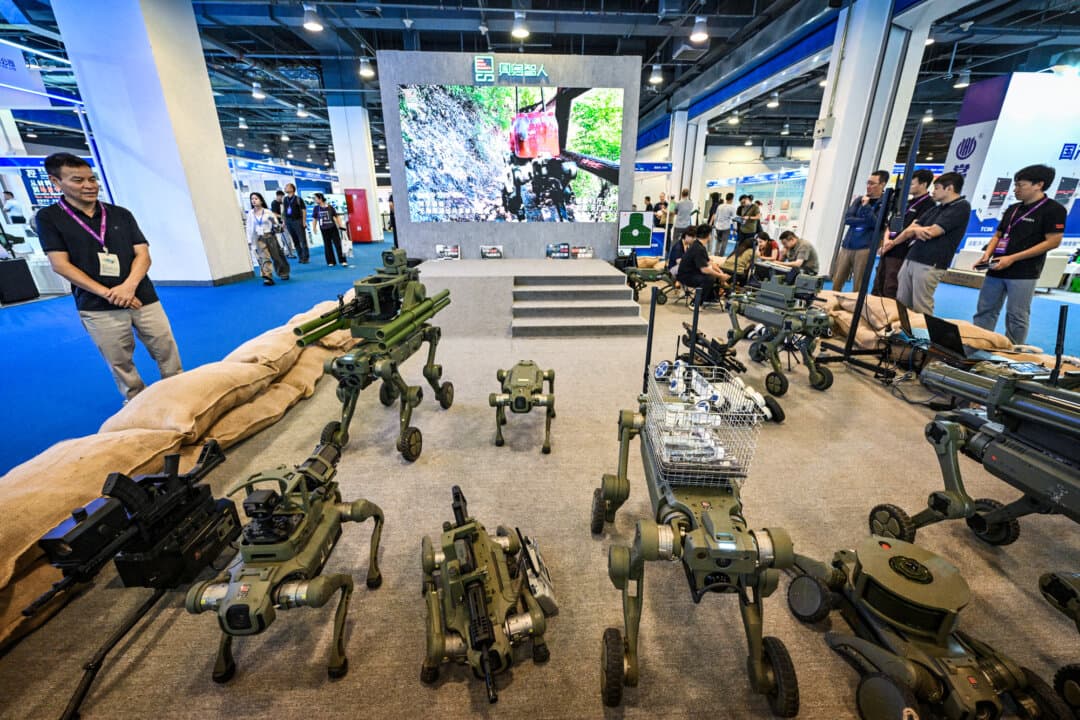 People view robotic dogs made for military and police use, during the 14th China International Defense Electronics Exhibition in Beijing on Sept. 15, 2026. (Adek Berry/AFP via Getty Images)