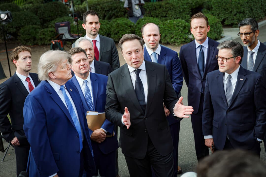 President Donald Trump stands with (L–R) Meta CEO Mark Zuckerberg, National Intelligence Director Jay Clayton, presidential adviser David Sacks, Anthropic founder Tom Brown, SpaceX CEO Elon Musk, OpenAI CEO Greg Brockman, National Cyber Director Sean Cairncross, Speaker of the House Mike Johnson (R-La.), and Google CEO Sundar Pichai, during a press briefing with AI executives following a meeting at the White House on Sept. 29, 2026. (Kevin Dietsch/Getty Images)