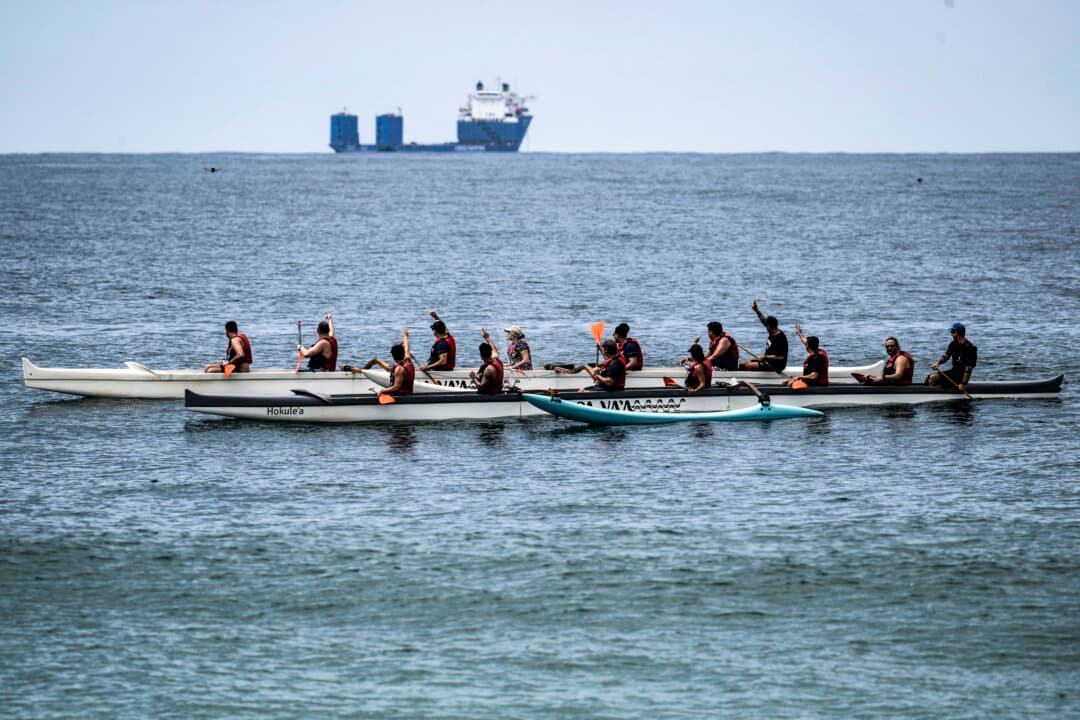 Rowers train off Copacabana Beach in Rio de Janeiro, on Oct. 6, 2026. (Pablo Porciuncula/AFP via Getty Images)