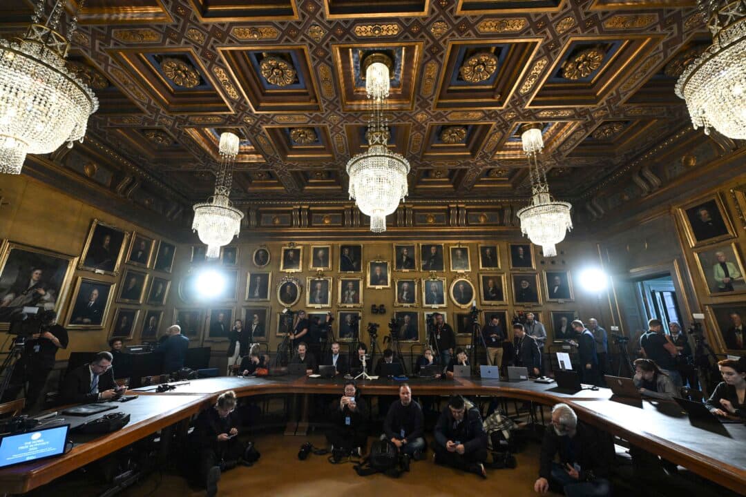 Journalists wait ahead of the announcement of the winners of the 2026 Nobel Prize in Physics at the Royal Swedish Academy of Sciences in Stockholm, on Oct. 6, 2026. (Jonathan Nackstrand/AFP via Getty Images)