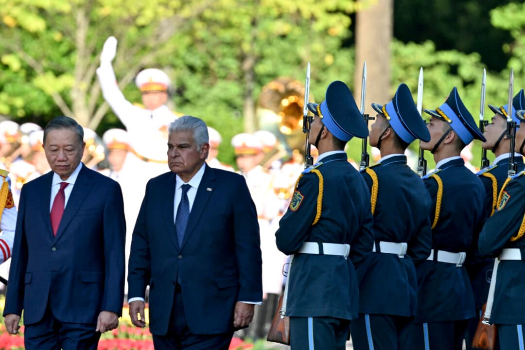 Vietnam's President To Lam (L) and Panama's President Jose Raul Mulino (2nd L) review an honour guard during a welcoming ceremony at the National Assembly House in Hanoi, Vietnam, on Oct. 6, 2026. (Nhac Nguyen/AFP via Getty Images)