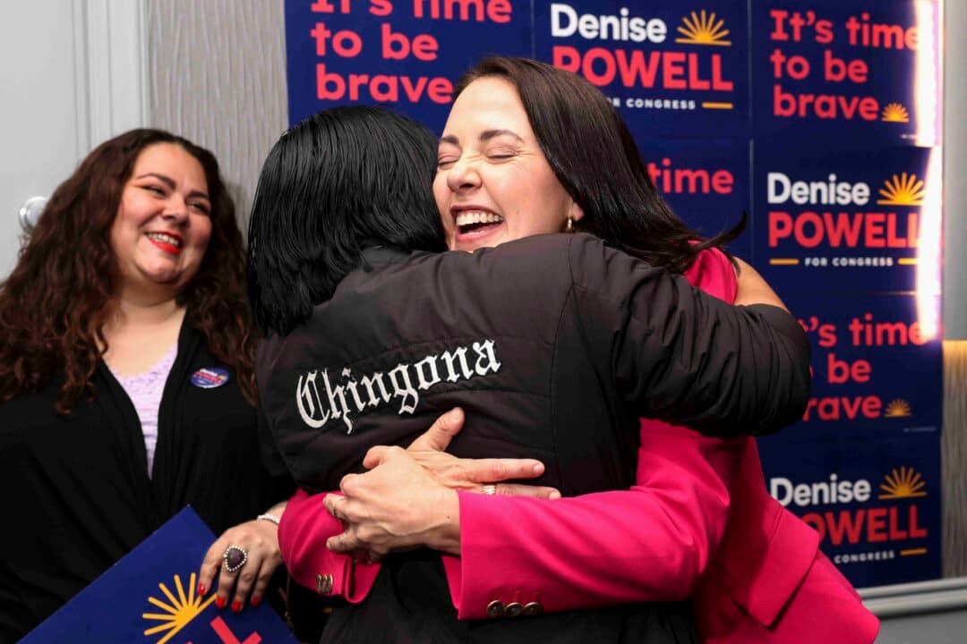 Denise Powell, (R), Democrative House candidate for Nebraska's Second Congressional District, hugs Jennifer Reyna, chair of the Nebraska Democratic Party's Latino Caucus, during a watch party in Omaha, Neb., on May 13, 2026. (Rebecca S. Gratz/AP Photo)