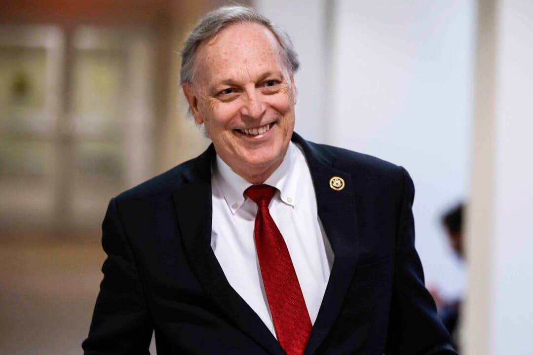 (Left) Arizona Gov. Katie Hobbs delivers the State of the State address at the Arizona state Capitol in Phoenix on Jan. 9, 2023. (Right) Rep. Andy Biggs (R-Ariz.), the Republican gubernatorial candidate, in Washington on Feb. 21, 2024. (Ross D. Franklin/AP Photo, Chip Somodevilla/Getty Images)