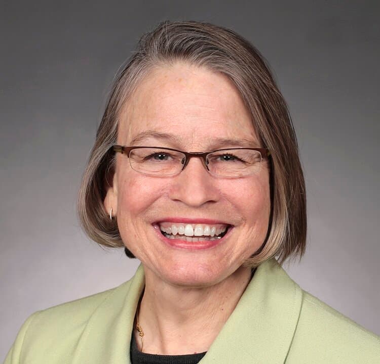 (Left) Then-Iowa state Sen. Mariannette Miller-Meeks, in an official portrait from 2019. (Right) Then-Iowa state Rep. Christina Bohannan, in an official portrait from 2021. (Iowa State Senate, Iowa General Assembly)