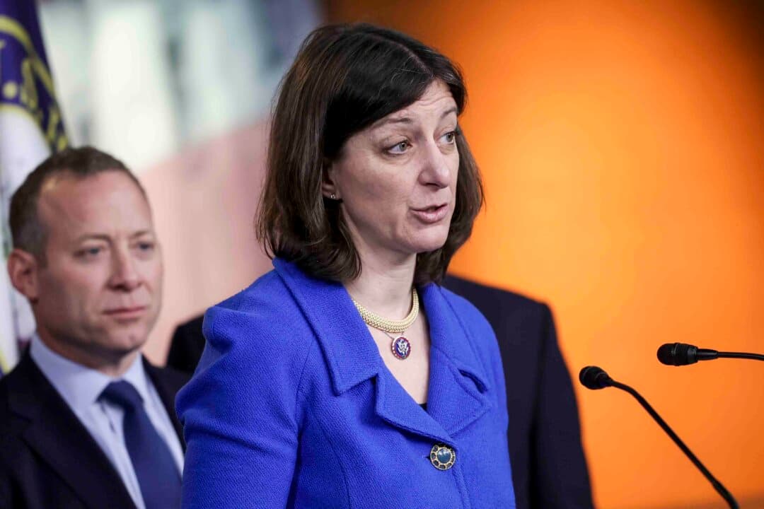 (Left) Then-Rep. Elaine Luria (D-Va.) speaks alongside Rep. Josh Gottheimer (D-N.J.) on Capitol Hill in Washington on April 6, 2022. (Right) Rep. Jen Kiggans (R-Va.) speaks during an event in Virginia Beach, Va., on July 1, 2026. (Kevin Dietsch/Getty Images, Ken Cedeno/Pool/AFP via Getty Images)