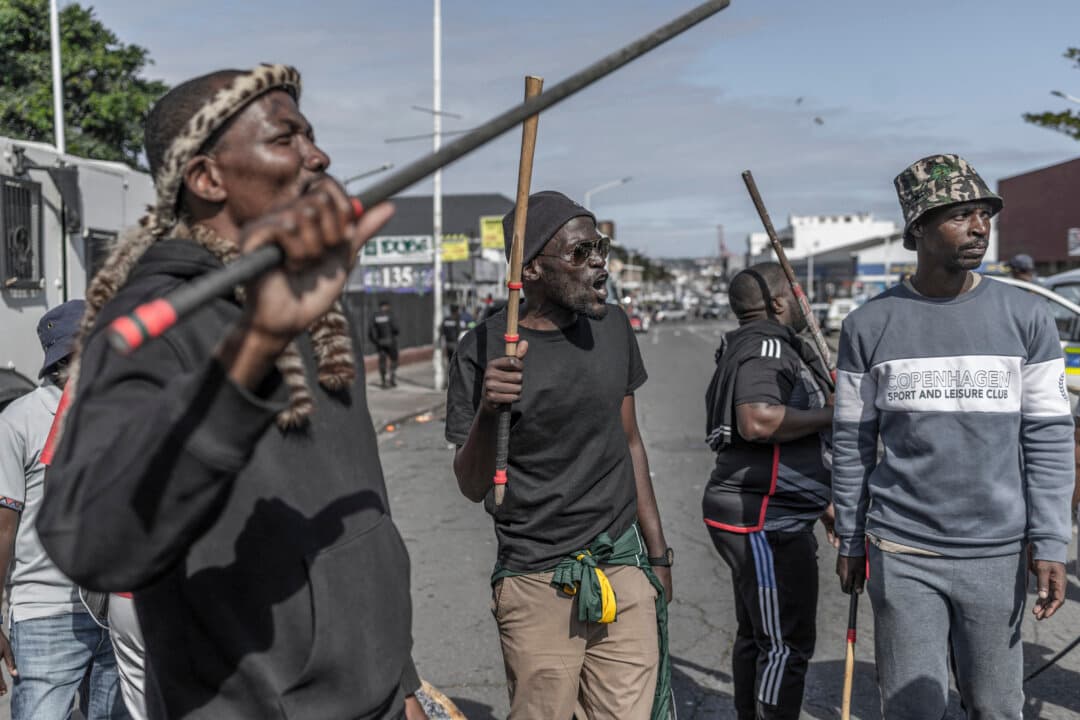 Members of the anti-illegal immigration group March and March protest outside the Department of Home Affairs Refugee Reception Center in Durban, South Africa, on Oct. 7, 2026. (Rajesh Jantilal/AFP via Getty Images)