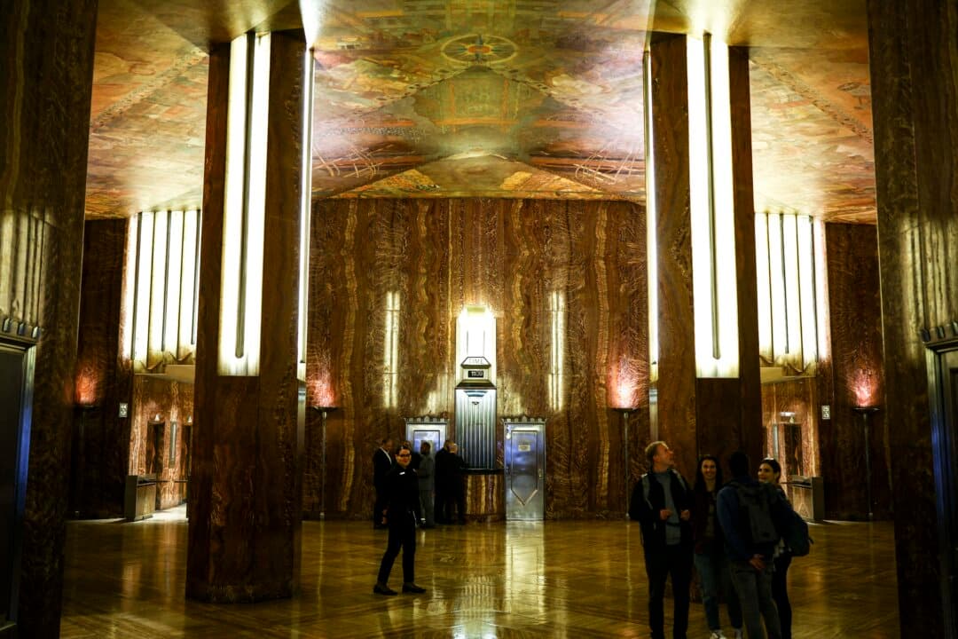 People walk through the lobby of the Chrysler Building in New York on Oct. 7, 2026. A real estate firm announced plans to buy and extensively renovate the art deco landmark. (Charly Triballeau/AFP via Getty Images)