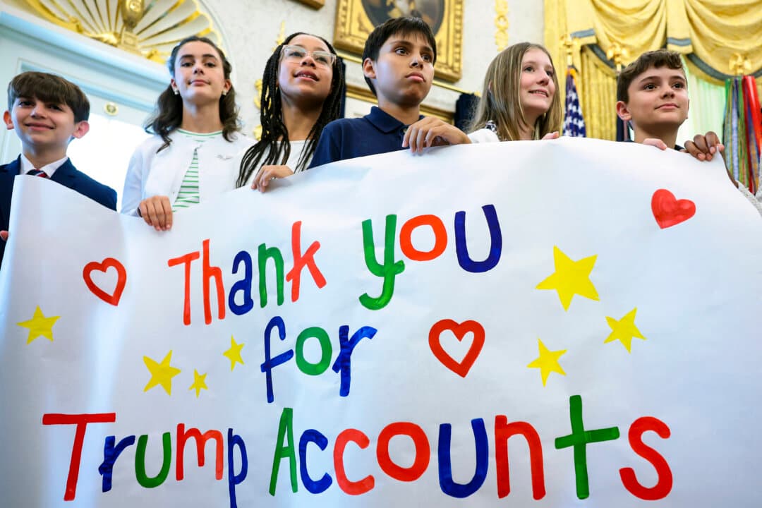 Children show their gratitude for Trump Accounts during an event with the president in the Oval Office on Oct. 7, 2026. President Donald Trump announced that automatic enrollment in the $1,000 government seed deposit for children born between 2025 and 2028 is now active. (Anna Moneymaker/Getty Images)
