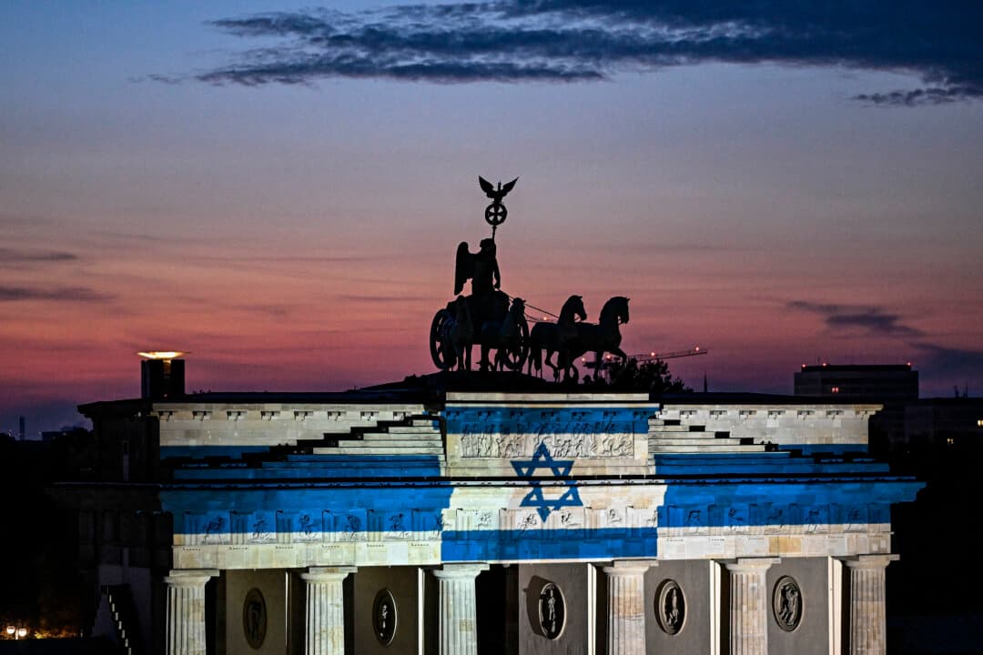 The landmark Brandenburg Gate illuminated with the Israeli flag in Berlin on Oct. 7, 2026, three years after the Hamas terrorist attack on Israel. (Tobias Schwarz/AFP via Getty Images)