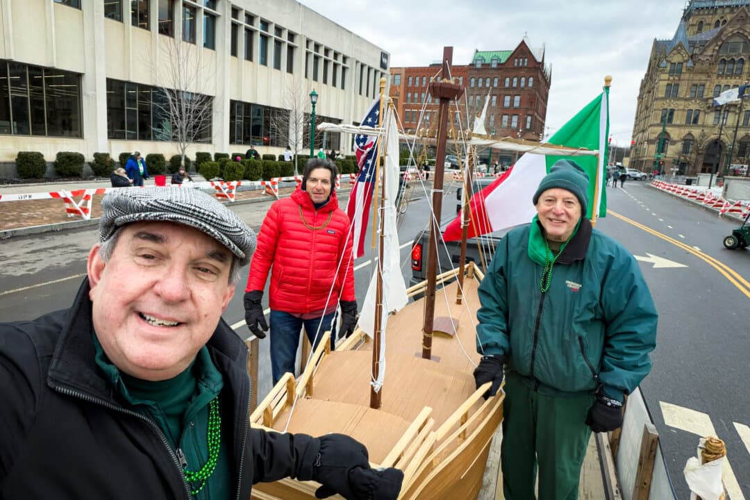 Columbus Monument Corp. board members (L–R) Anthony Ilacqua, Richard Pietrafesa, and Nick Pirro stand with a model of Christopher Columbus's ship during the St. Patrick's Day parade in Syracuse, N.Y., on March 14, 2026. (Courtesy of Anthony Ilacqua)