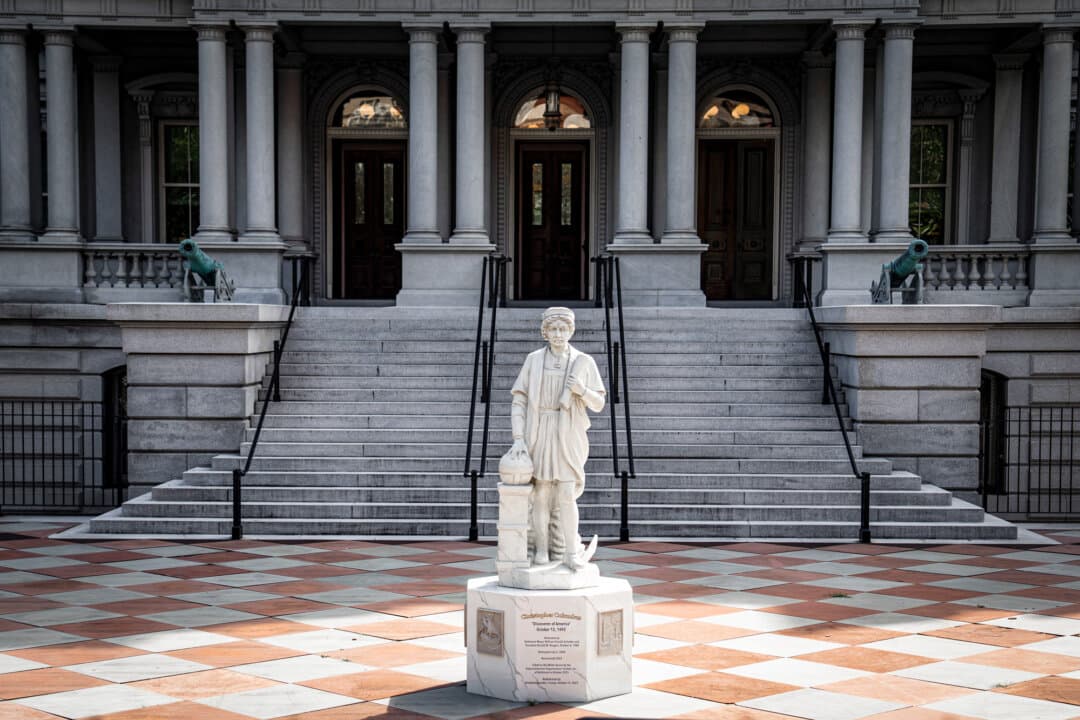 A statue of Christopher Columbus in front of the Eisenhower Executive Office Building in Washington on Sept. 30, 2026. (Madalina Kilroy/The Epoch Times)