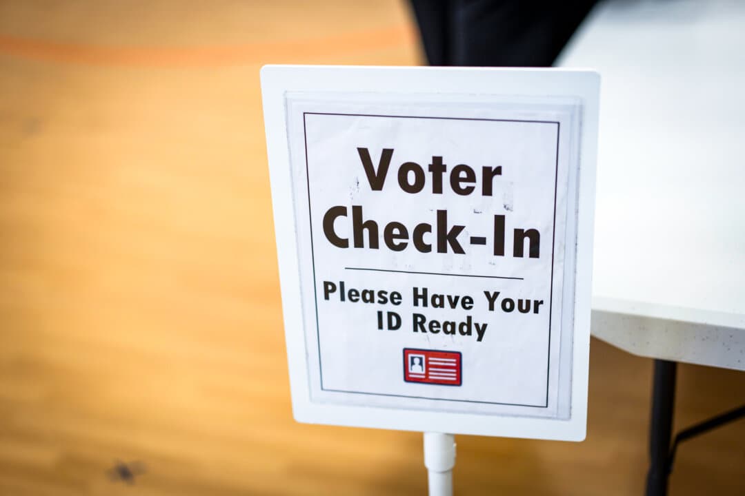 Voter check-in at a polling site during a redistricting referendum, in Alexandria, Va., on April 21, 2026. (Madalina Kilroy/The Epoch Times)