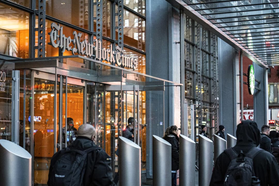 The New York Times Building in New York City on Feb. 5, 2024. The media outlet, along with more than a dozen other outlets, is suing OpenAI and Microsoft for using news content to train AI models, without providing compensation or obtaining permission.(Samira Bouaou/The Epoch Times)