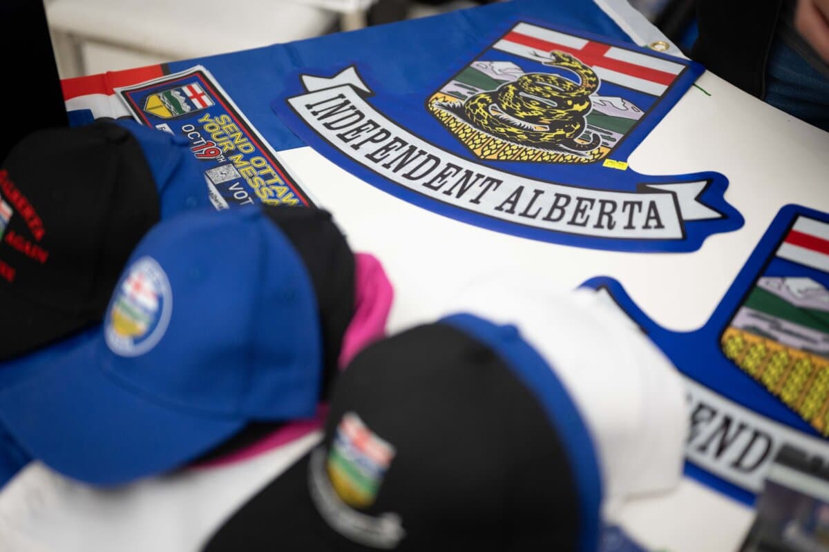 Items in support of Alberta independence featured at a Let's Talk Alberta event held in Calgary on Oct. 13, 2026. (Carlos Herrera for The Epoch Times)