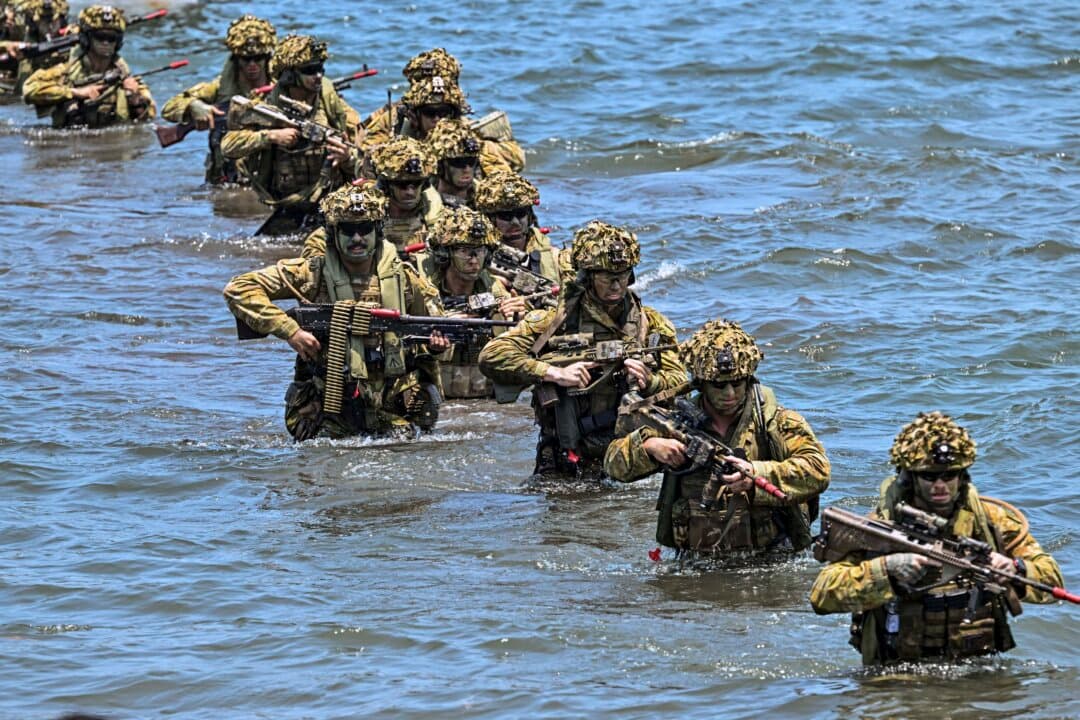 Members of the Australian Defence Force take part in the Keris Woomera joint military drills with Indonesian marines at Banongan beach in Situbondo, Indonesia, on Oct. 15, 2026. (Juni Kriswanto/AFP via Getty Images)