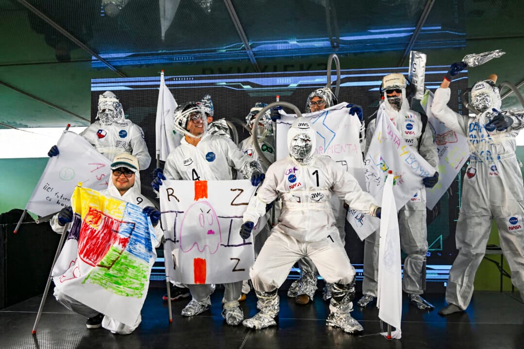 Students wearing improvised astronaut suits participate in the first hackathon at the University of Chile in Santiago on Oct. 15, 2026. Around 200 participants joined Breaking Barriers, a hackathon organized by Amazon Web Services in Latin America. (Rodrigo Arangua/AFP via Getty Images)