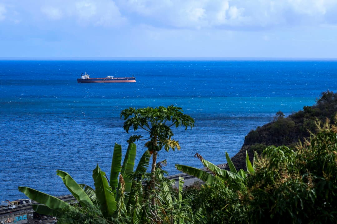 The Russian shadow fleet oil tanker DF PEAK is escorted by the French Navy toward La Possession Bay, off the coast of Réunion island in the Indian Ocean, on Oct. 15, 2026. Authorities imposed maritime restrictions around the vessel ahead of its arrival. (Richard Bouhet/AFP via Getty Images)