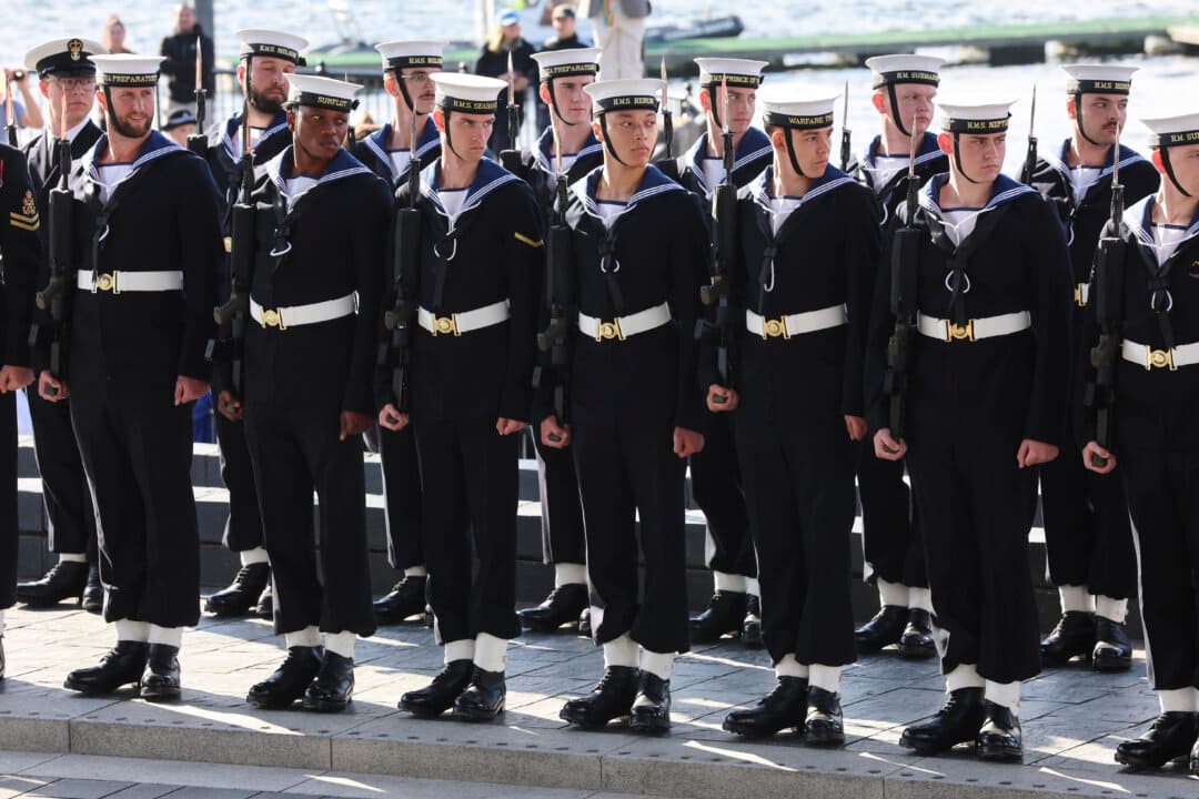 Members of the Royal Navy line the street ahead of the Ceremonial Opening of the Seventh Senedd in Cardiff, Wales, United Kingdom, on Oct. 15, 2026. The ceremony marked the formal opening of the expanded Welsh Parliament. (Chris Jackson/Getty Images)