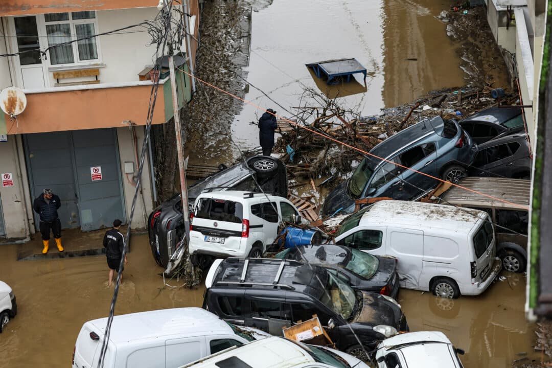 Car owners search for their vehicles swept away by the flood after a heavy rain at Ayazaga district in Istanbul, on Oct. 15, 2026. The city struggled to recover from its heaviest rainfall in more than 80 years, which caused flash floods, traffic chaos, and swept away cars. (Berk Ozkan/AFP via Getty Images)