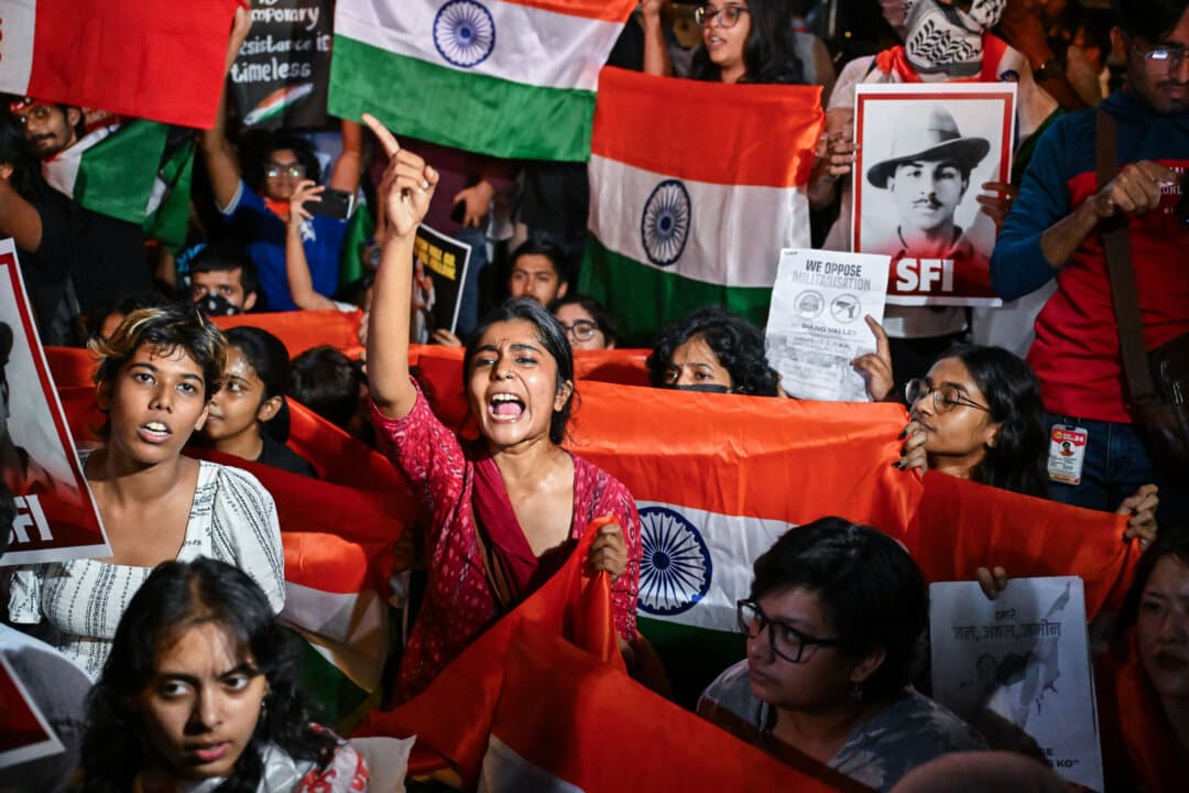 Members of the Cockroach Janta Party protest in New Delhi on Oct. 16, 2026, calling on supporters across India to carry national flags as part of its campaign demanding the resignation of Chief Election Commissioner Gyanesh Kumar over alleged irregularities. (Ritesh Shukla/Getty Images)