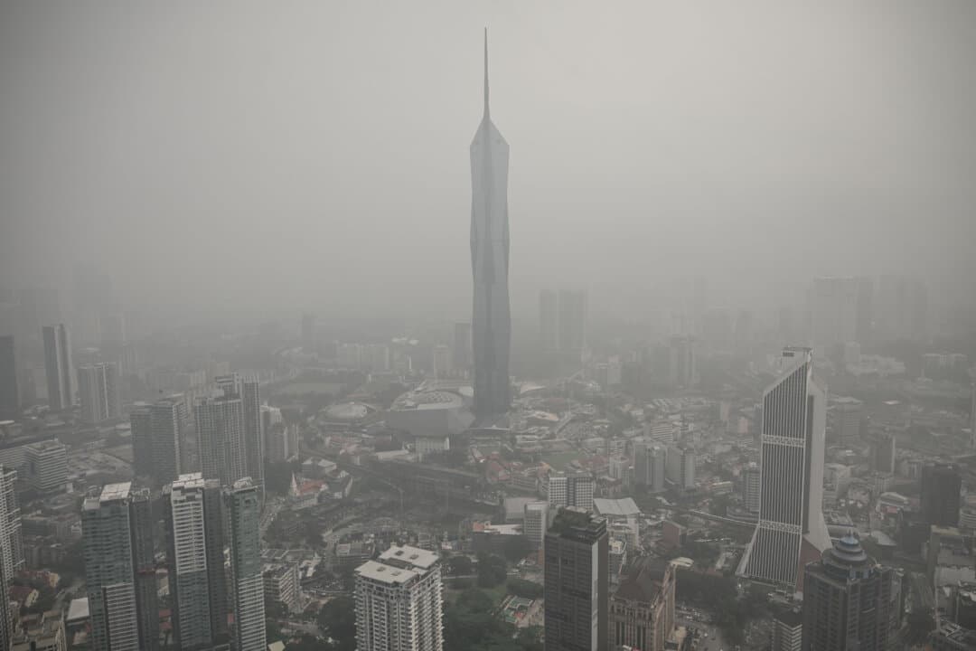 Buildings are shrouded in haze caused by fires in Indonesia, in Kuala Lumpur, Malaysia, on Oct. 16, 2026. Toxic haze has covered parts of Indonesia, Malaysia, and Singapore for weeks as fires burn large areas of Borneo and Sumatra, with smoke drifting across the region. (Jam Sta Rosa/AFP via Getty Images)