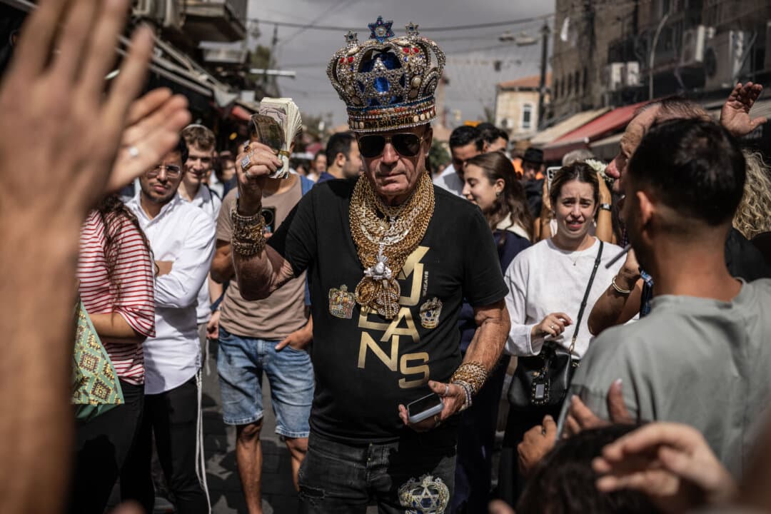 Eitan Shvili, also known as King Sharshar, leader of the King Sharshar political party, walks through the Mahane Yehuda market in Jerusalem on Oct. 16, 2026. In less than two weeks, Israel is scheduled to hold its first election since the Hamas-led terrorist attack on Southern Israel on Oct. 7, 2023, in a vote widely seen as a referendum on Prime Minister Benjamin Netanyahu. (John Wessels/AFP via Getty Images)