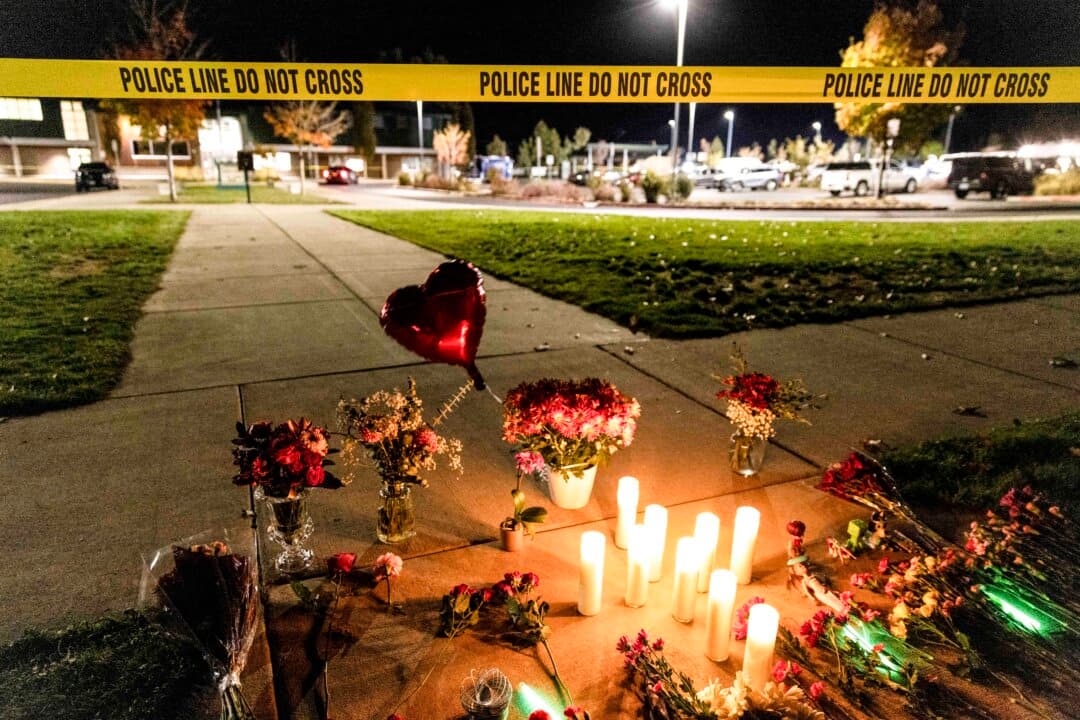 Candles and flowers at a makeshift memorial outside the Silver Rail Elementary School following a shooting in Bend, Ore., on Oct. 15, 2026. (Payton Bruni/AFP via Getty Images)