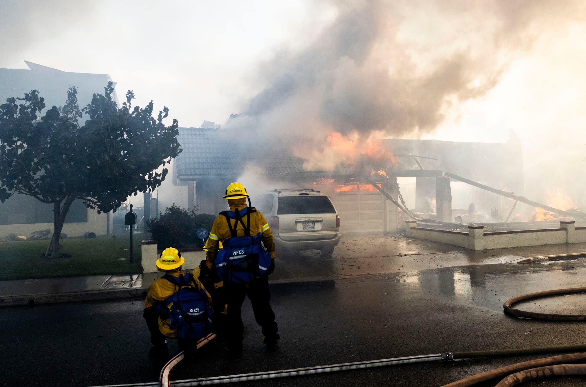 Firefighters work to save structures on Via La Mirada during the Norte fire in San Clemente, Calif., on Oct. 16, 2026. (Paul Bersebach/The Orange County Register via AP)
