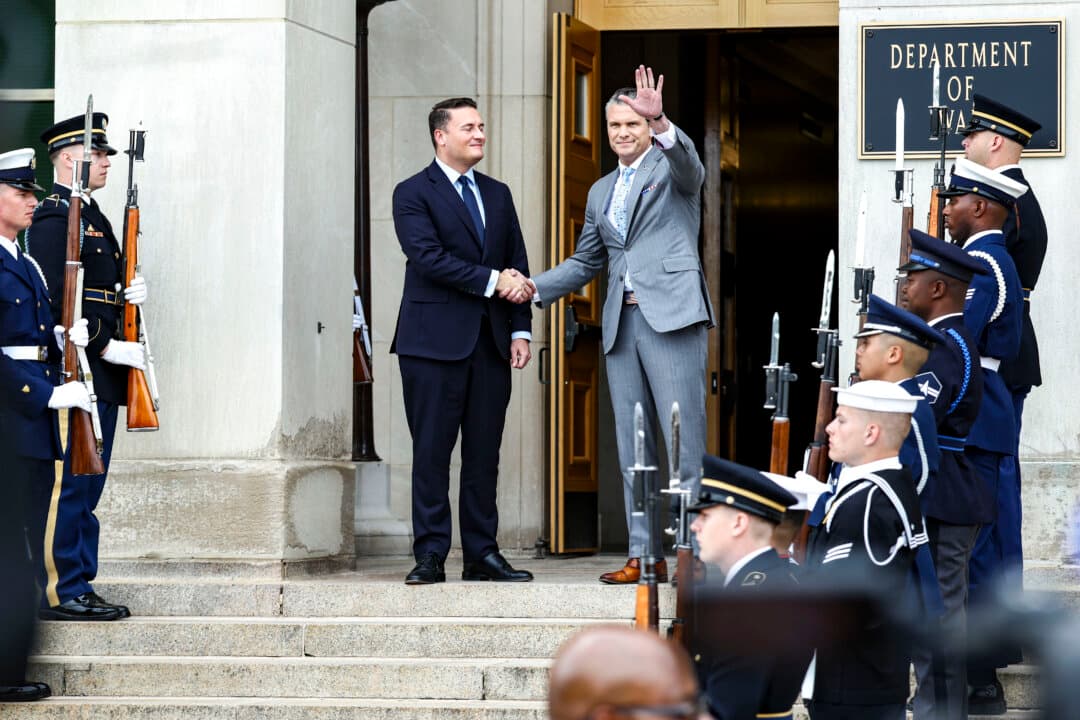 British Defense Secretary Wes Streeting and Secretary of War Pete Hegseth shake hands at the Pentagon in Arlington, Va., on Oct. 15, 2026. The two defense officials discussed NATO financial commitments by European countries. (Finn Gomez/Getty Images)