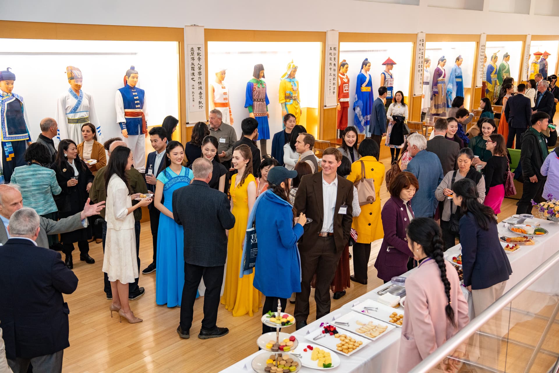 Guests and Shen Yun performers mingle at the screening of “Unbroken” at Dragon Springs, home of Shen Yun Performing Arts, in Cuddebackville, N.Y., on Oct. 17, 2026. (Samira Bouaou/The Epoch Times)