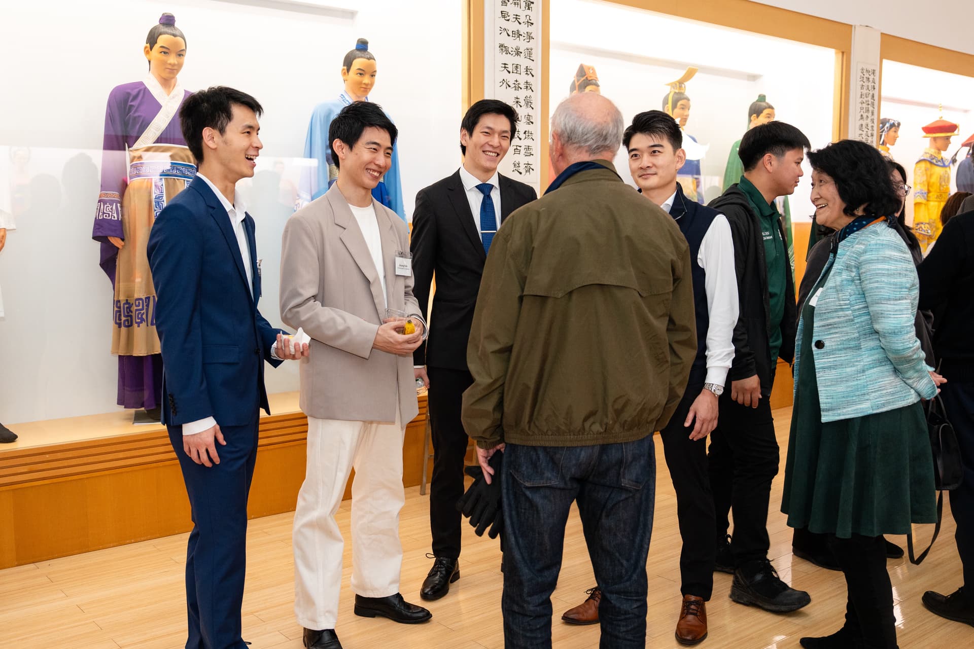Shen Yun dancers mingle with attendees at the screening of “Unbroken” at Dragon Springs, home of Shen Yun Performing Arts, in Cuddebackville, N.Y., on Oct. 17, 2026. (Samira Bouaou/The Epoch Times)