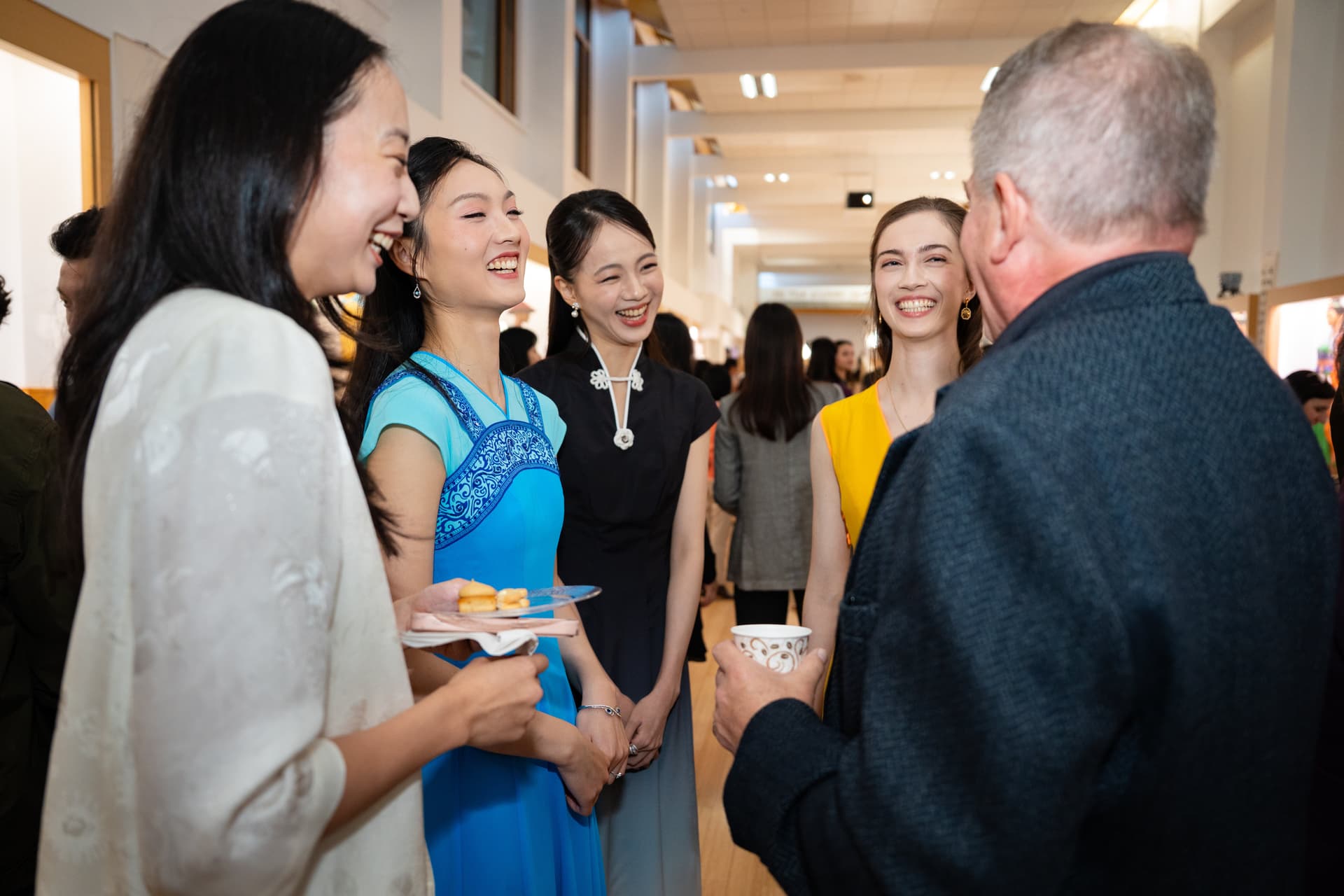 Shen Yun dancers mingle with attendees at the Screening of “Unbroken” at Dragon Springs, home of Shen Yun Performing Arts, in Cuddebackville, N.Y., on Oct. 17, 2026. (Samira Bouaou/The Epoch Times)