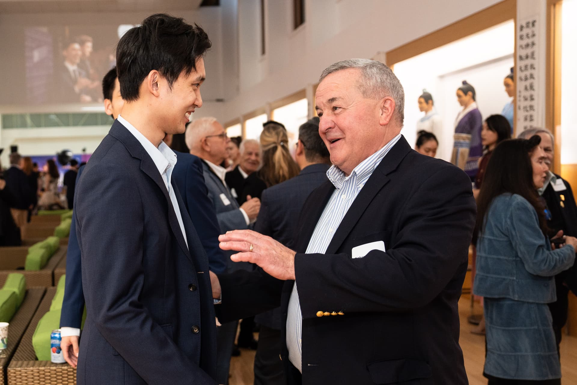 Richard Guertin, former Orange County Court judge, speaks with Shen Yun artists at the screening of “Unbroken” at Dragon Springs, home of Shen Yun Performing Arts, in Cuddebackville, N.Y., on Oct. 17, 2026. (Samira Bouaou/The Epoch Times)