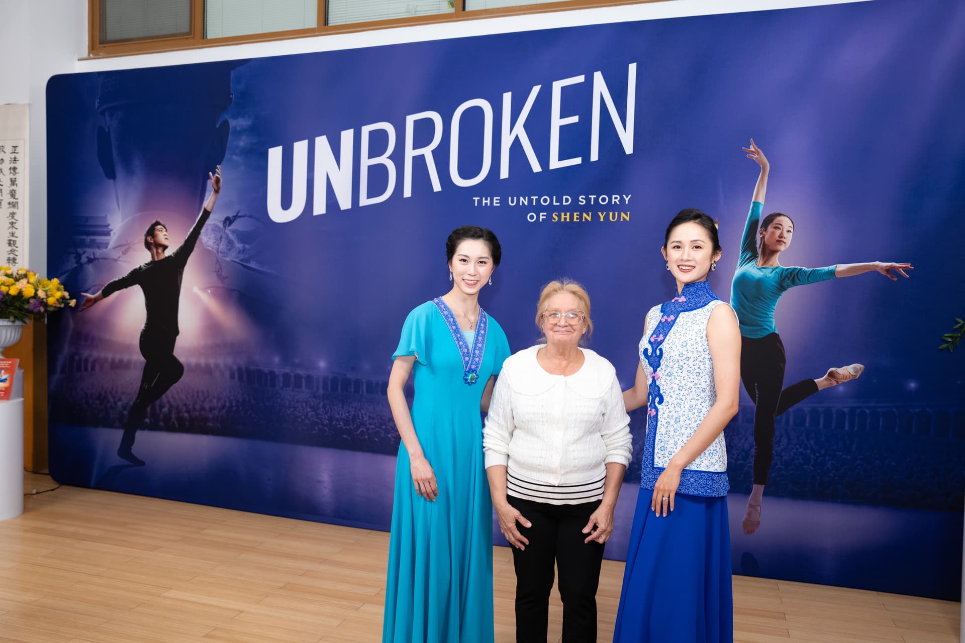 Martha Flores-Vazquez (C), New York state Assembly district leader for Flushing, New York, poses with Shen Yun artists at the screening of “Unbroken” at Dragon Springs, home of Shen Yun Performing Arts, in Cuddebackville, N.Y., on Oct. 17, 2026. (Larry Dye/The Epoch Times)