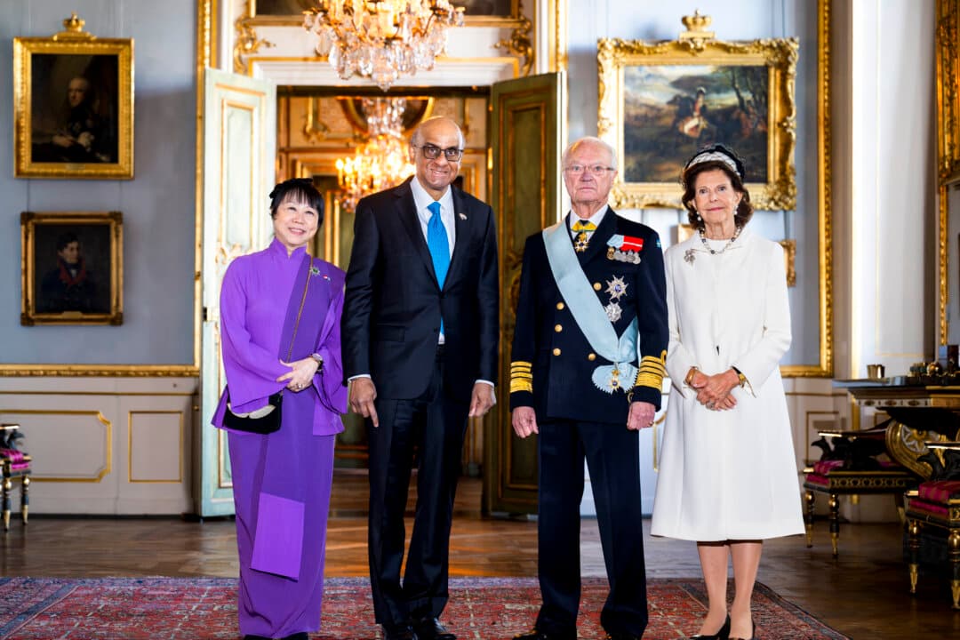King Carl XVI Gustaf of Sweden (2nd R) and Queen Silvia of Sweden (R) with Singapore's President Tharman Shanmugaratnam (2nd L) and his wife Jane Yumiko Ittogi (L) at the Royal Palace in Stockholm, on Oct. 19, 2026, during their three-day state visit. (Jonas Ekstromer/TT News Agency/AFP via Getty Images)