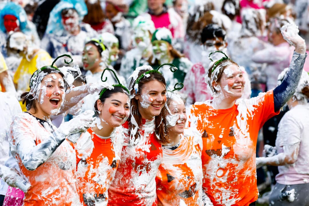 Students take part in a shaving foam fight during Raisin Monday at the University of St Andrews in St Andrews, Scotland, on Oct. 19, 2026. The annual tradition celebrates the university’s peer-mentoring system, with first-year students wearing costumes and joining festivities organized by older students. (Jeff J Mitchell/Getty Images)