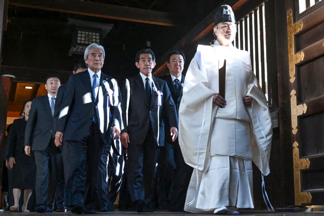 Japanese parliament members visit Yasukuni Shrine to pray for the war dead in Tokyo on Oct. 19, 2026. (Rie Kikuchi/AFP via Getty Images)
