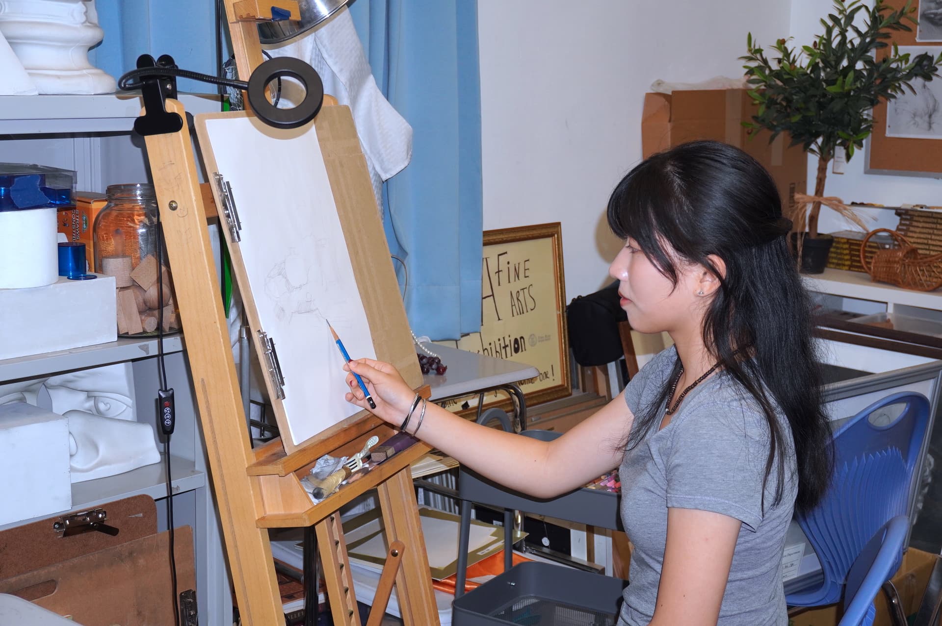 Maggie Jiang paints in an art studio at Northern Academy of the Arts in upstate New York. (Lily Yu/The Epoch Times)