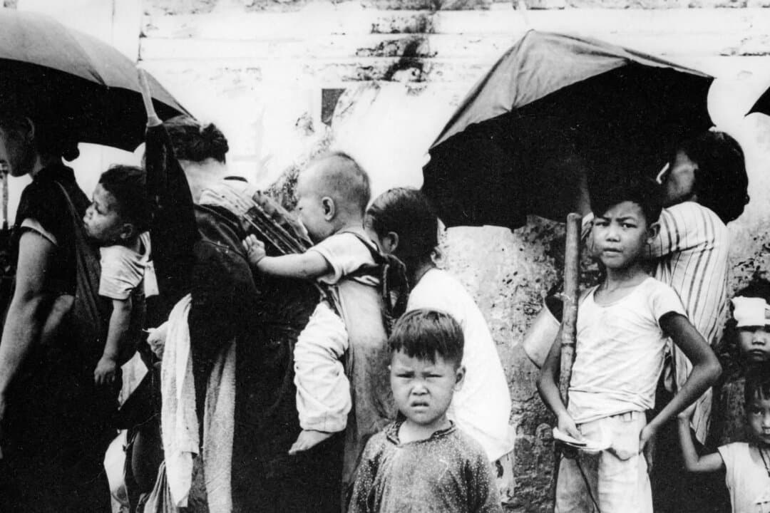 (Left) Cambodian children scavenge amid the ruins left by an insurgent Khmer Rouge attack on a shanty town on the edge of Phnom Penh, Cambodia, in February 1974. Hunger would continue to be a way of life for these children: Famine would claim the lives of up to 1.5 million people in Cambodia after the Khmer Rouge seized control. (Center) Russian children display the ravages of malnutrition in west-central Russia, in 1921. The Russian famine of 1921–1922 killed an estimated 5 million people. A decade later, the Soviet famine of 1932–1933 would result in the deaths of up to 10.8 million people. (Right) Chinese refugees wait for a meal in Hong Kong in May 1962. During the famine caused by Mao Zedong's "Great Leap Forward," up to 200,000 starving Chinese fled to British-ruled Hong Kong. (Carl D. Robinson/AP Photo/File, Public Domain, AFP Photo via Getty Images)