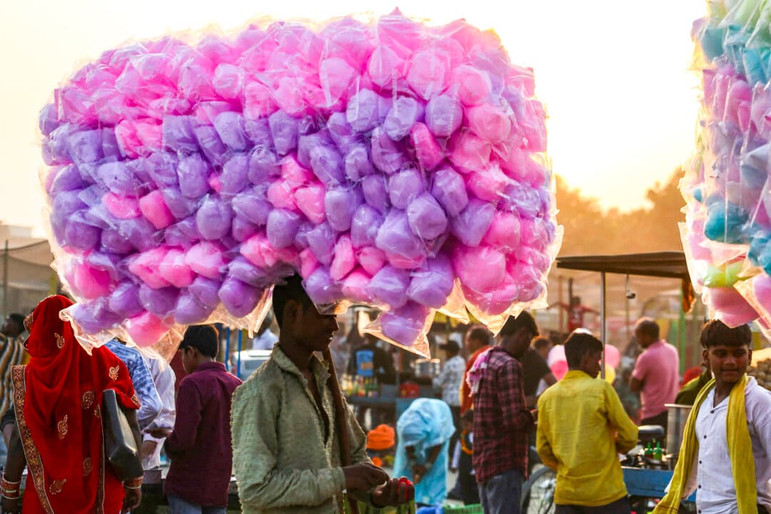 A cotton candy vendor looks for customers during a fair in Ramnagar on the outskirts of Varanasi, India, on Oct. 20, 2026. (Niharika Kulkarni/AFP via Getty Images)