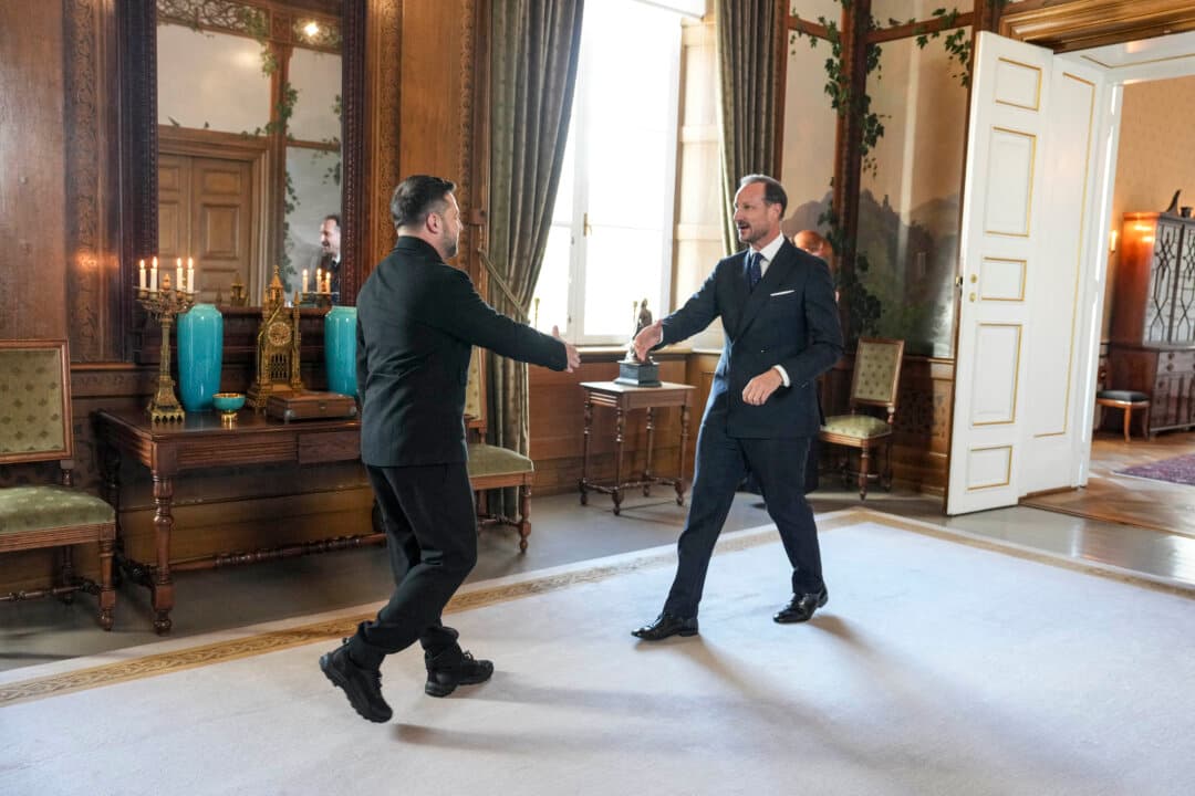 King Haakon VIII of Norway (R) reaches out to greet Ukraine's President Volodymyr Zelensky at the Royal Palace in Oslo, on Oct. 20, 2026. (Ole Berg-Rusten/NTB/AFP via Getty Images)