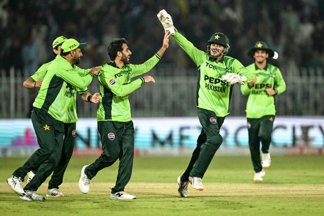 Pakistan's Arafat Minhas (3L) celebrates with teammates after taking the wicket of England's Gus Atkinson during the one-day international (ODI) tri-series cricket match between Pakistan and England at the Rawalpindi Cricket Stadium in Rawalpindi, Pakistan, on Oct. 20, 2026. (Aamir Qureshi/ AFP via Getty Images)