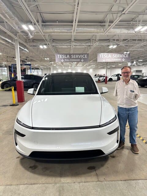 John Foppe, founder of the nonprofit Friends of the Forgotten, with his Model Y Tesla. (Courtesy of John Foppe)