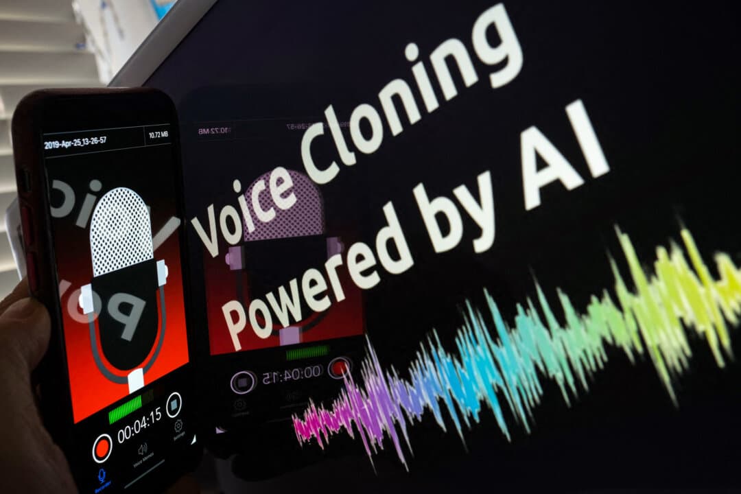 This illustration image created on June 9, 2023, shows a smartphone recording in front of a voice cloning screen in Los Angeles. “Vishing” scams involve fraudsters who use convincing AI voice cloning tools to steal from people by impersonating family members. (Chris Delmas / AFP via Getty Images)