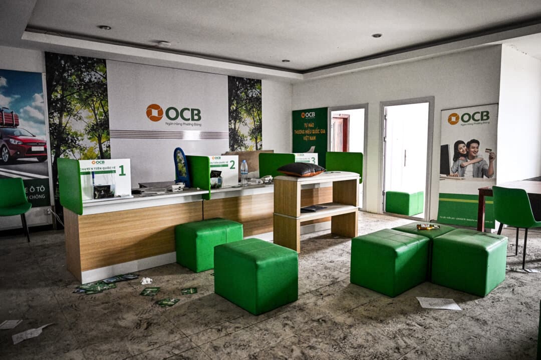 A room set up to resemble a bank branch is pictured inside an abandoned scam center in O'Smach, Cambodia, on March 12, 2026. Most “pig butchering” scams originate from vast scam centers in Southeast Asia, run by Chinese organized crime syndicates. (Lillian Suwanrumpha / AFP via Getty Images)