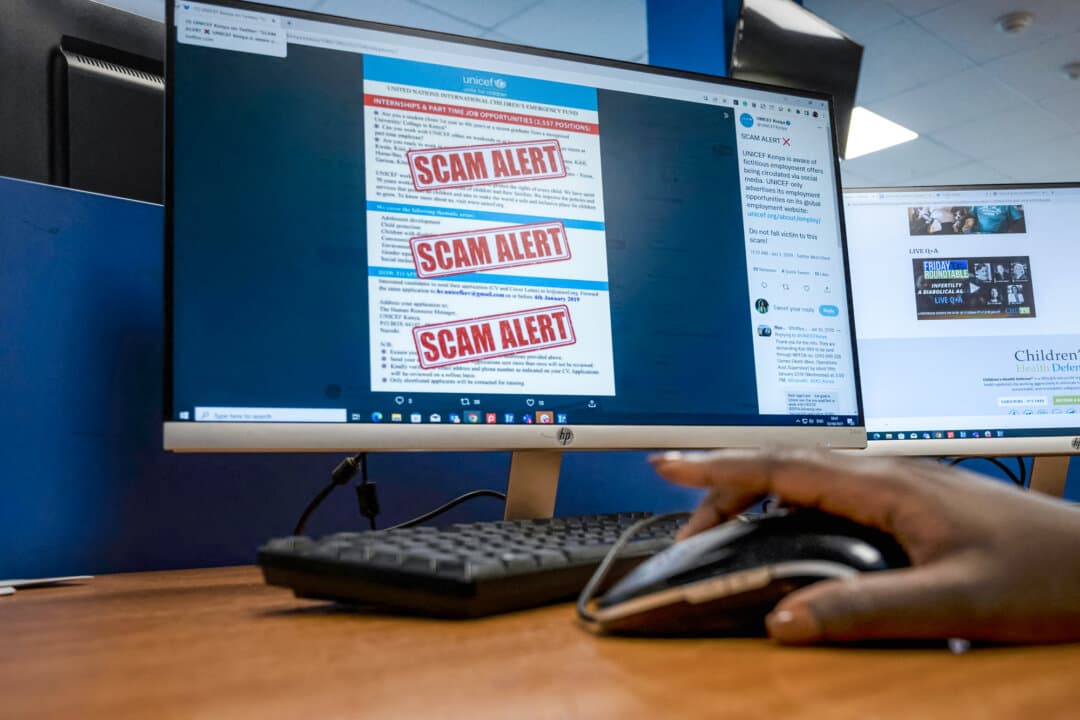 A researcher browses an internet site with a job offer for a United Nations agency that has been flagged as a scam, in Nairobi, Kenya, on June 30, 2022. (Tony Karumba/AFP via Getty Images)